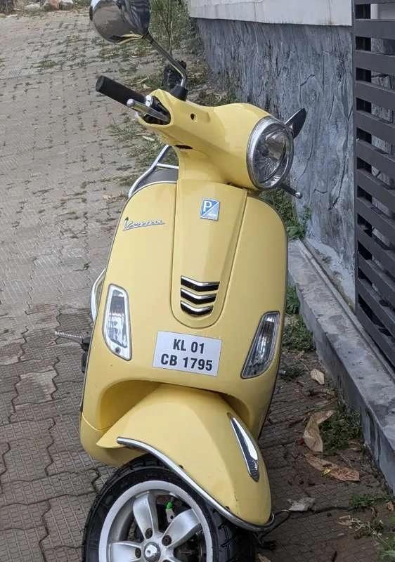 Yellow vespa for sale
