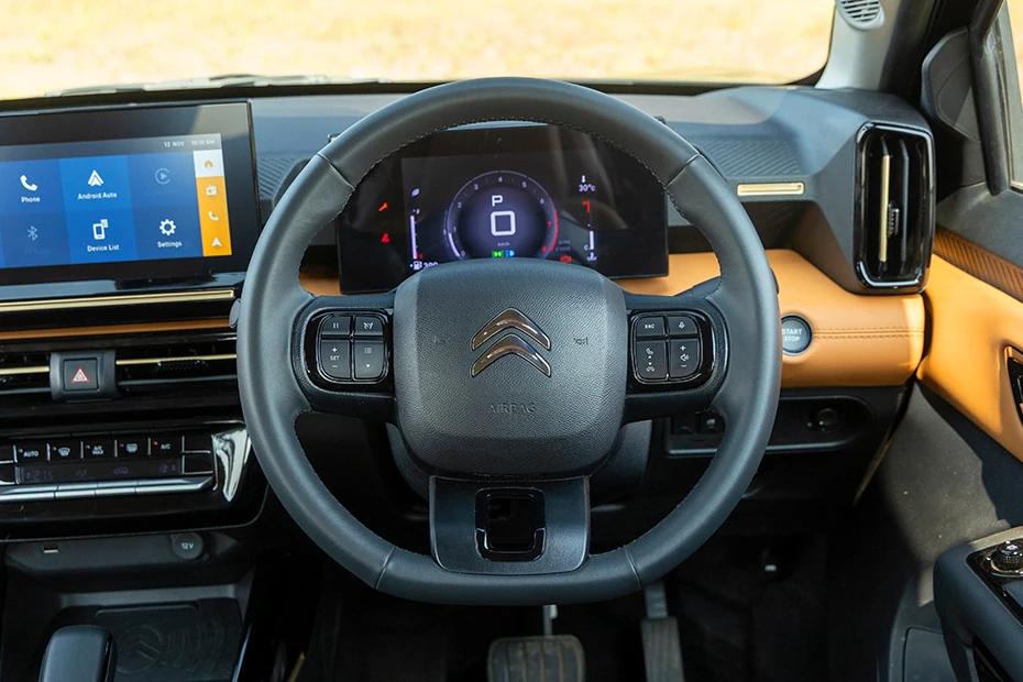 Citroen Basalt steering-wheel view highlighting grip, controls, and comfort