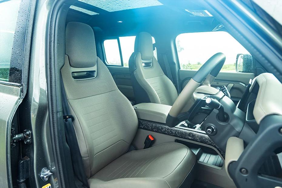 Land Rover Defender front-seats view highlighting support, padding, and comfort