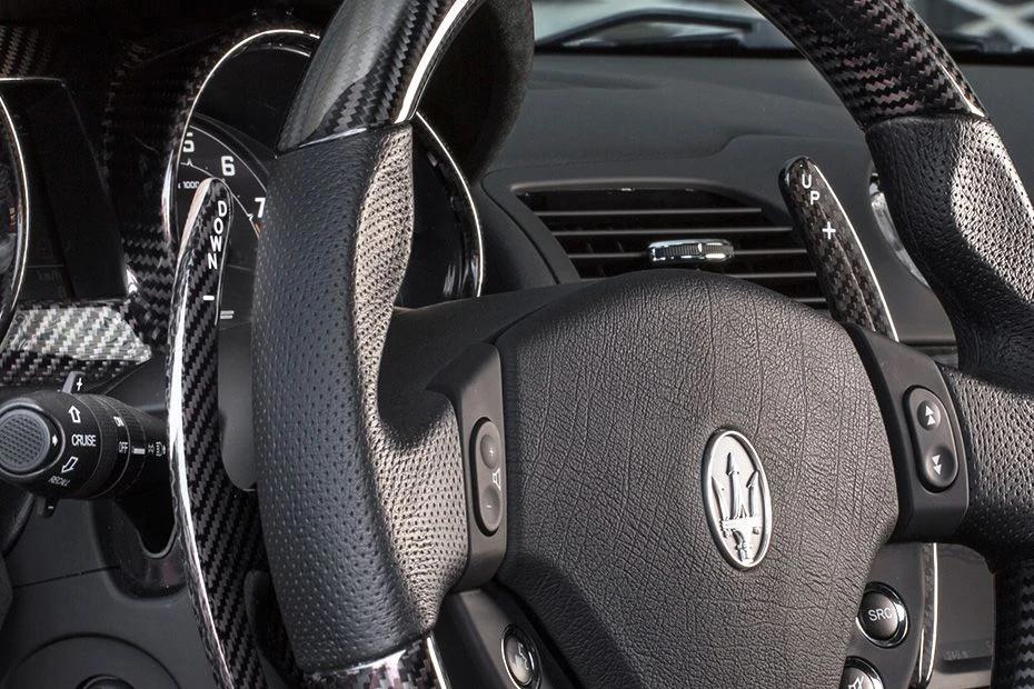Maserati Gran Cabrio steering-wheel view highlighting grip, controls, and comfort