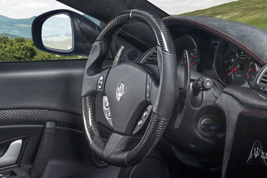 Maserati Gran Turismo steering-wheel view highlighting grip, controls, and comfort